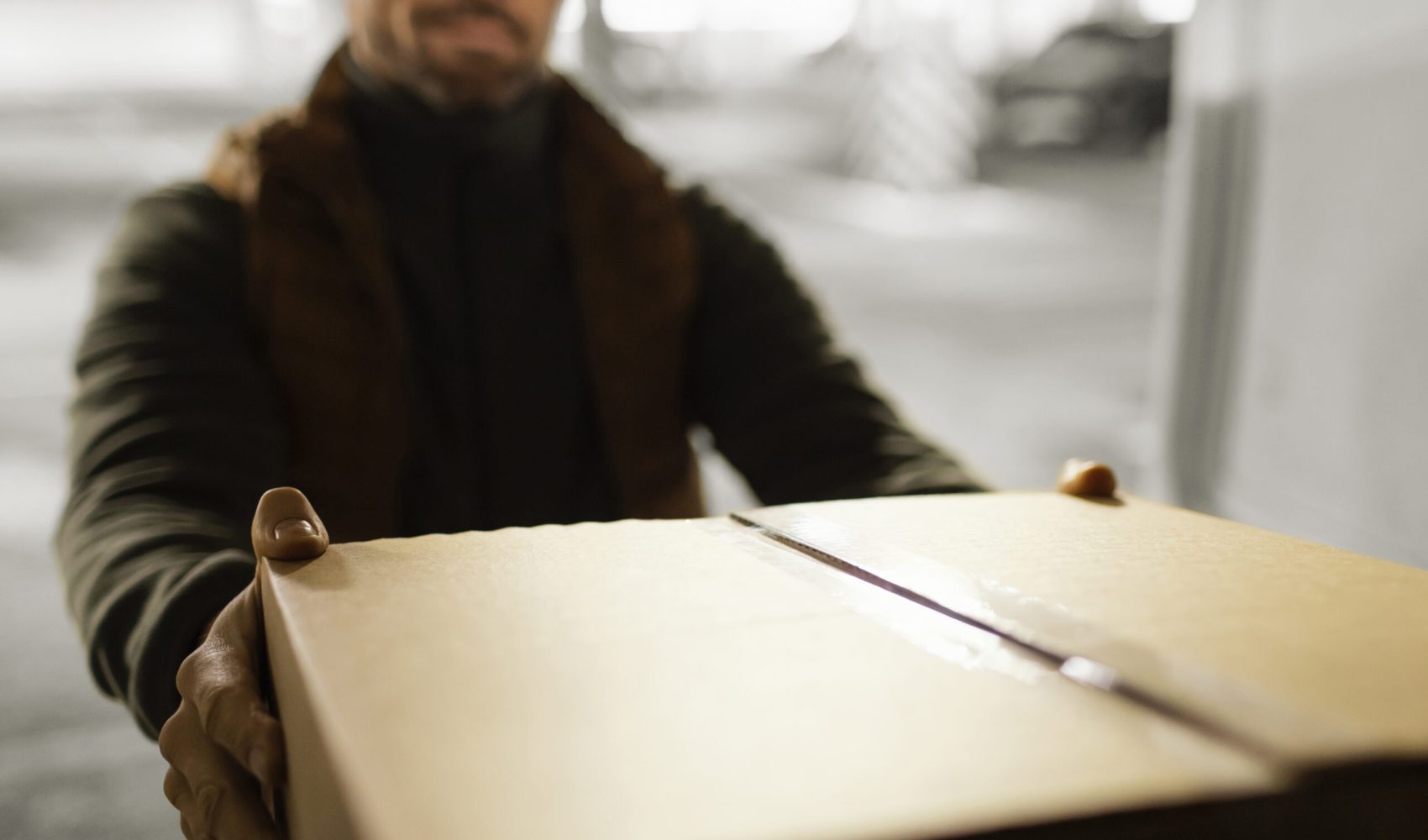 delivery-man-with-package-close-up